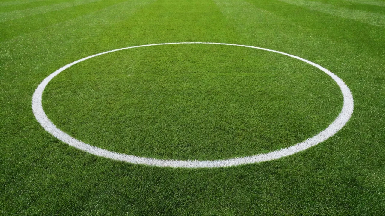 Football pitch centre circle line on vivid grass from above